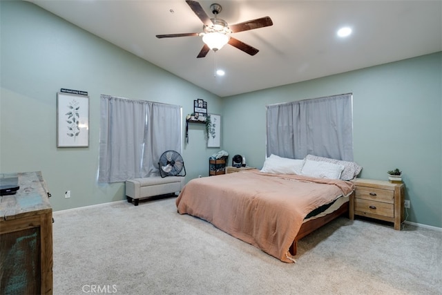 carpeted bedroom with vaulted ceiling and ceiling fan