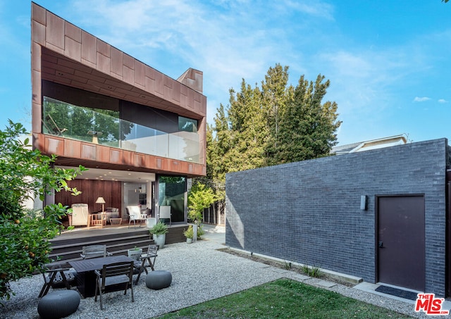 back of house featuring a patio area