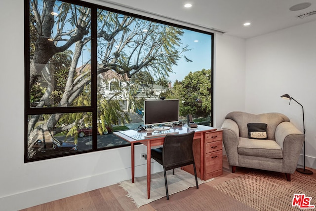 office space with light wood-type flooring