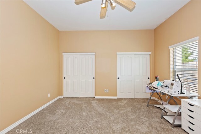 misc room featuring ceiling fan and light colored carpet