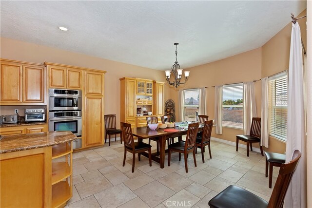 dining area featuring a chandelier