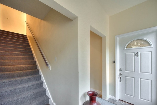 view of carpeted entrance foyer