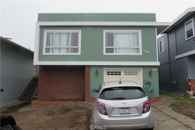 view of front of property featuring a garage