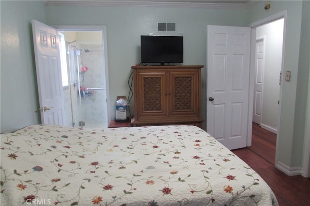 bedroom featuring dark wood-type flooring and crown molding