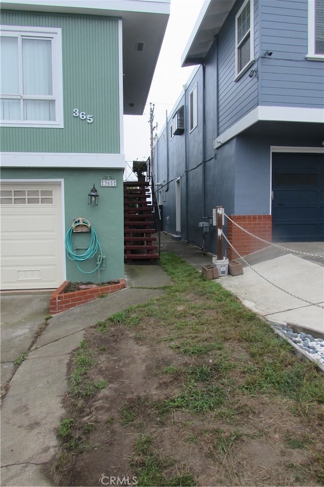 view of side of property featuring a garage