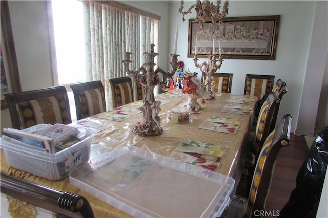 dining space with hardwood / wood-style floors