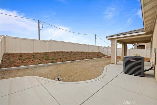 view of yard featuring a patio and central AC unit