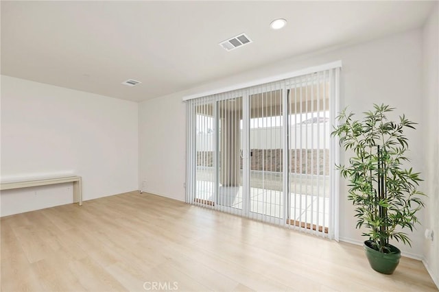 unfurnished room featuring light wood-type flooring