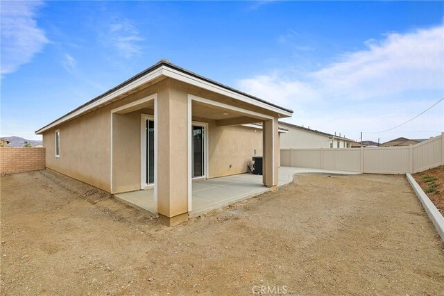 rear view of property with a patio area