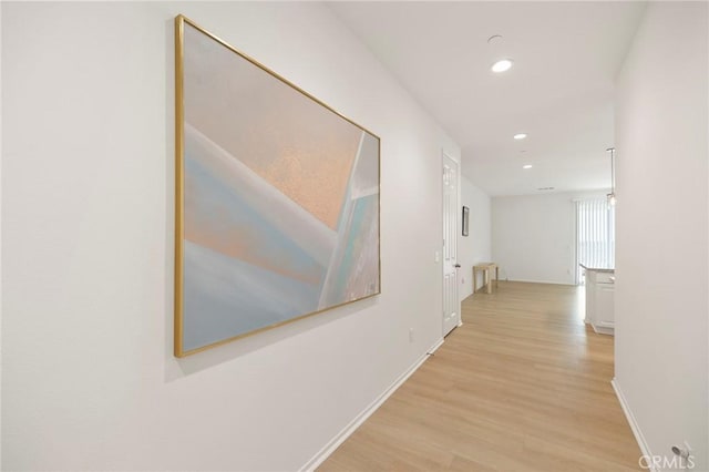 hallway featuring light hardwood / wood-style flooring