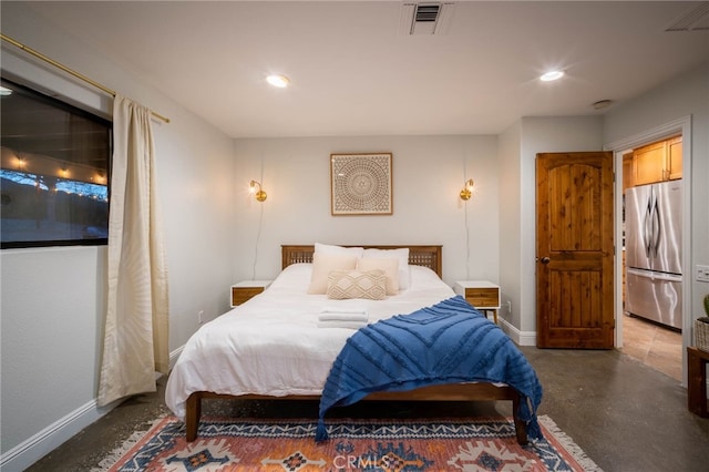 bedroom with stainless steel refrigerator