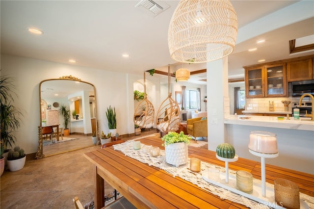 dining space featuring a chandelier