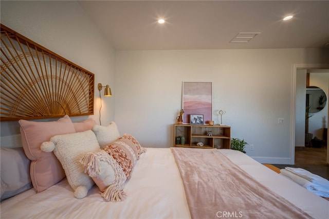 bedroom with hardwood / wood-style floors