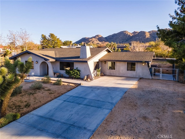 single story home featuring a mountain view