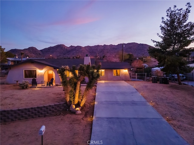 view of front of home with a mountain view