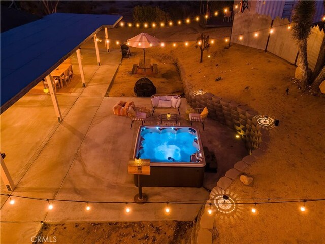 exterior space featuring a hot tub and a patio area