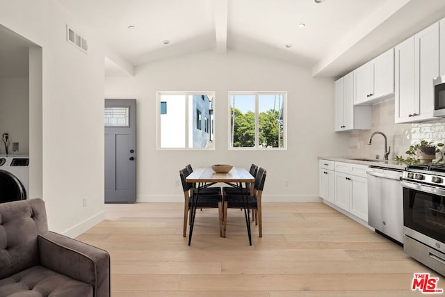 kitchen featuring light hardwood / wood-style flooring, white cabinetry, appliances with stainless steel finishes, and sink