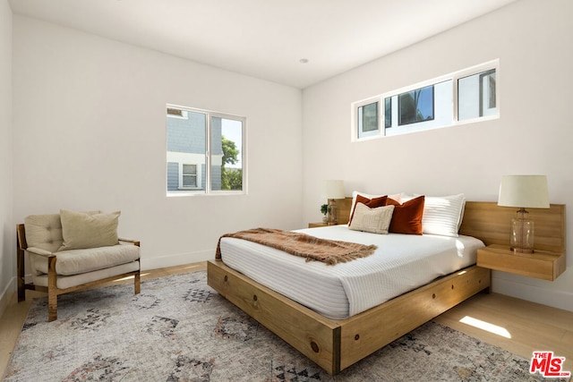 bedroom with light hardwood / wood-style flooring