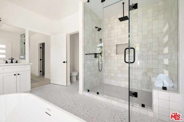 full bathroom featuring vanity, plus walk in shower, toilet, and tile patterned floors