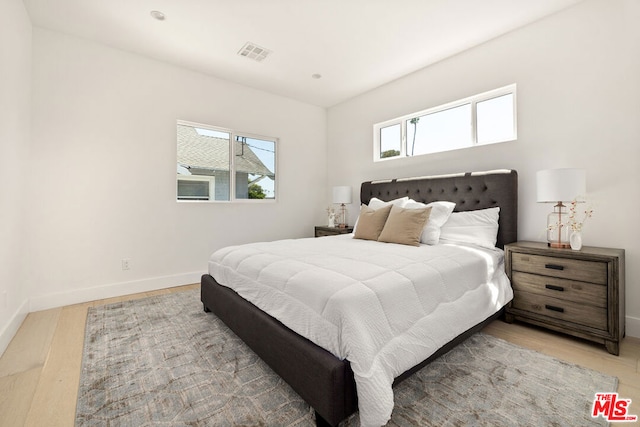 bedroom featuring wood-type flooring