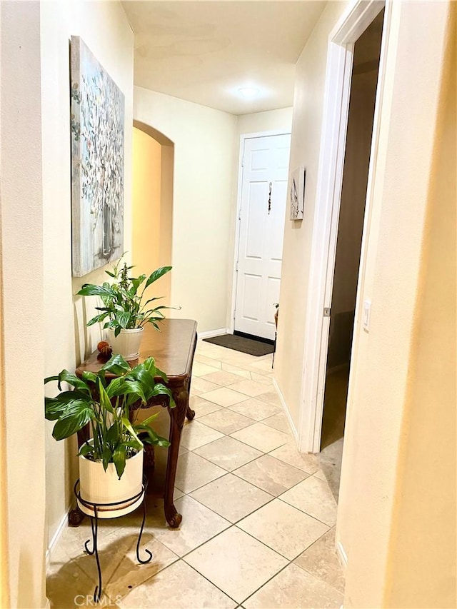 corridor featuring light tile patterned flooring