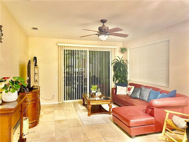 interior space featuring ceiling fan