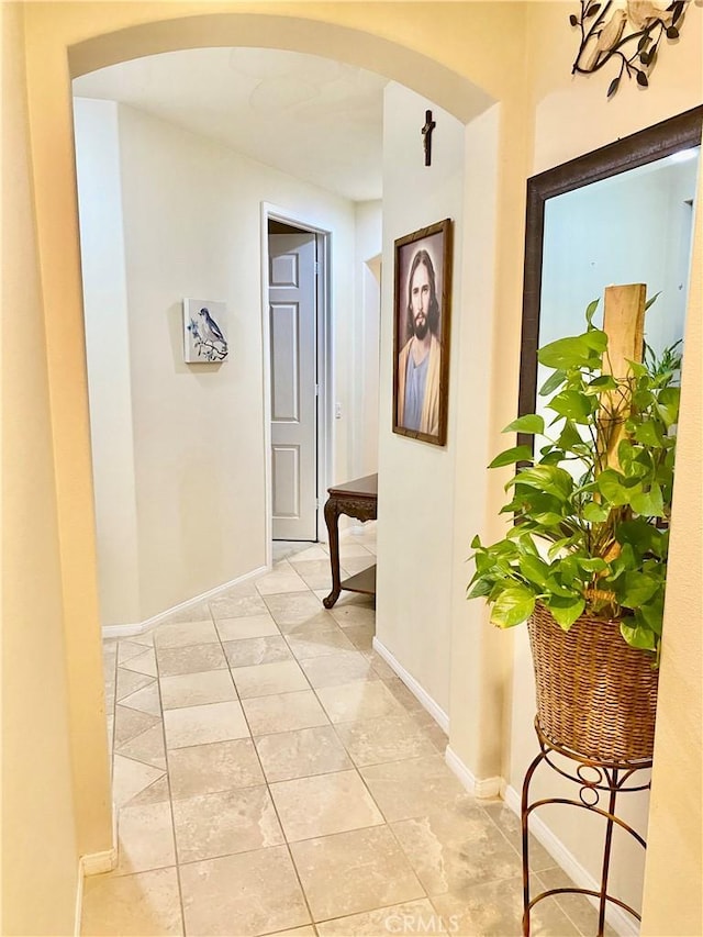 corridor with light tile patterned floors