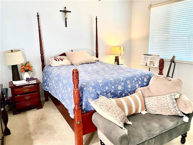 bedroom featuring light colored carpet