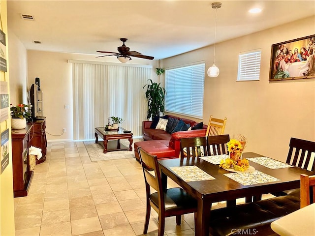 dining room featuring ceiling fan and light tile patterned flooring