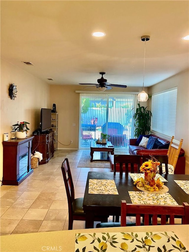 dining space featuring ceiling fan