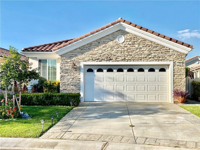 view of front of property with a front lawn and a garage