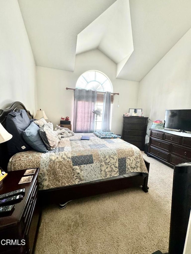 carpeted bedroom featuring vaulted ceiling