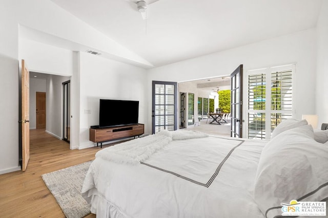 bedroom with ceiling fan, vaulted ceiling, access to outside, and light hardwood / wood-style flooring