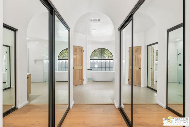 hallway featuring light wood-type flooring