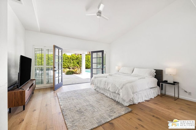 bedroom featuring french doors, access to outside, light hardwood / wood-style flooring, and ceiling fan