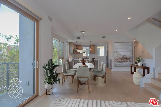 dining area with light hardwood / wood-style flooring