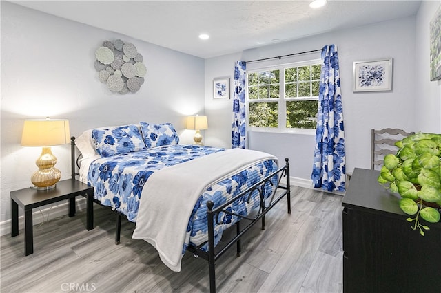 bedroom featuring hardwood / wood-style floors