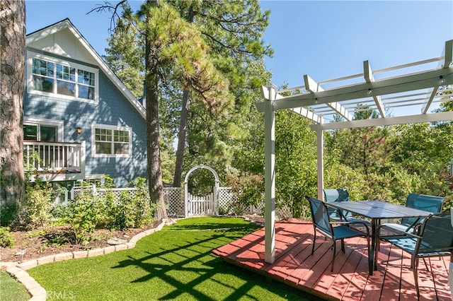 view of yard with a wooden deck and a pergola