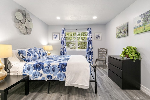 bedroom with wood-type flooring