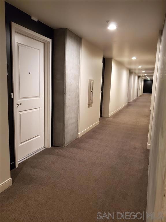 hallway with carpet flooring