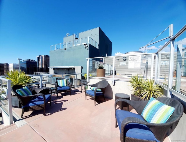 view of patio featuring a balcony