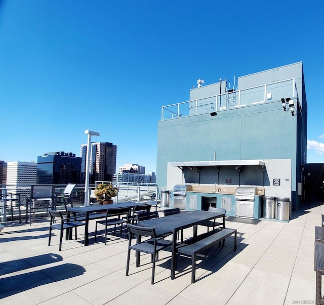 view of patio / terrace with area for grilling, sink, and an outdoor kitchen