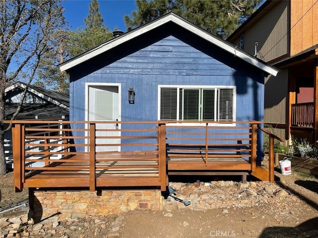 view of front of property featuring a wooden deck