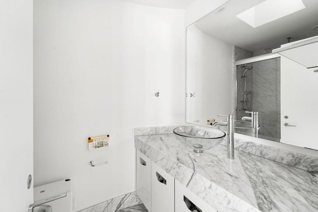 bathroom with vanity and an enclosed shower