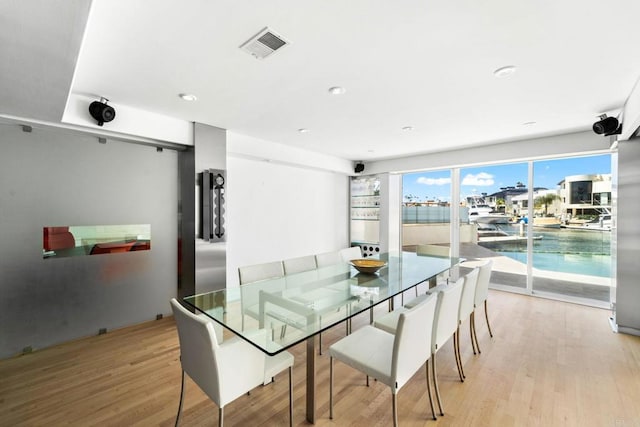 dining room with light hardwood / wood-style floors