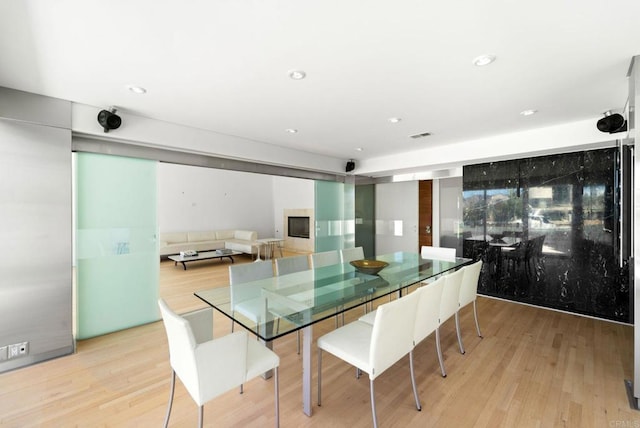 dining area with light hardwood / wood-style floors