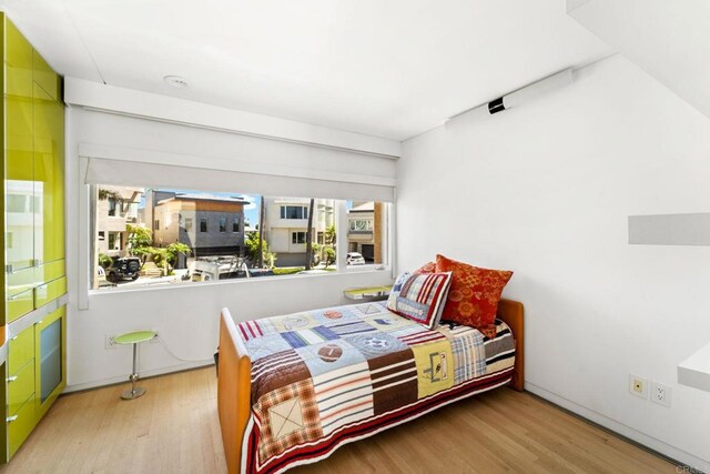 bedroom with light hardwood / wood-style floors