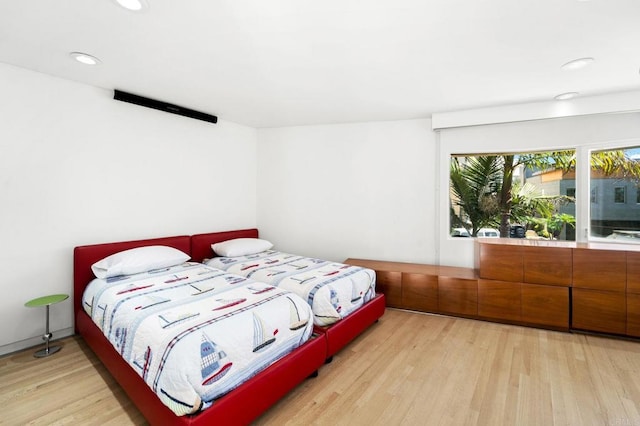 bedroom with light hardwood / wood-style flooring