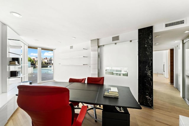 dining area with light hardwood / wood-style floors