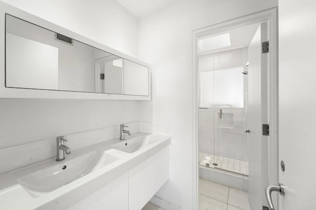 bathroom with vanity, tile patterned floors, and an enclosed shower